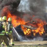 Firefighters extinguish car fire