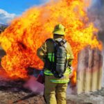 Firefighter putting out fire