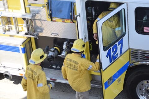 VCFD Firefighters getting into Engine 127